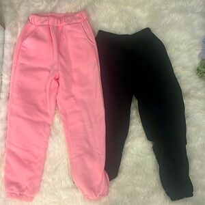 2 sweatpants one pink and one black sweatpants